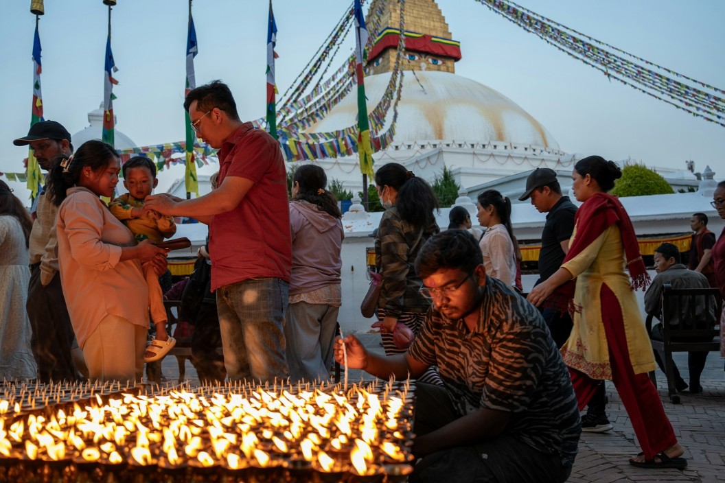 Lamp offering at Bouddha
